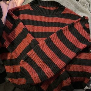 Pink/red and black striped sweater